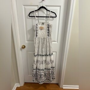 Mint Green strappy white tiered dress with black embroidery.Also some white knit